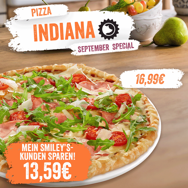 Pizza Indiana als September Special. Preis für Mein Smiley’s-Kunden 13,59 € statt 16,99 €. Abgebildet ist eine Pizza mit Rucola, Tomaten und Schinken.